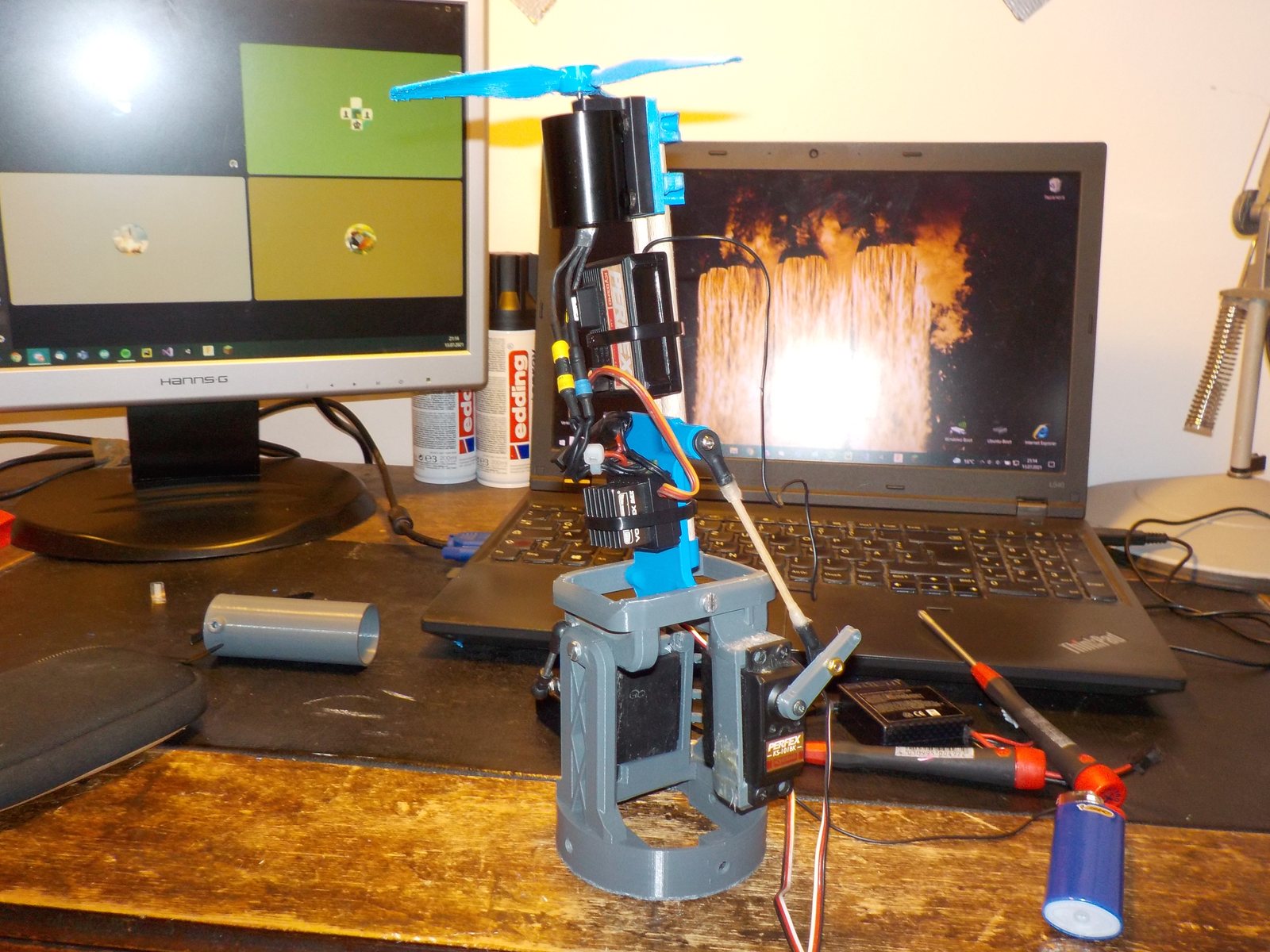 The mk2 gimbal on a test stand next to a laptop and a monitor